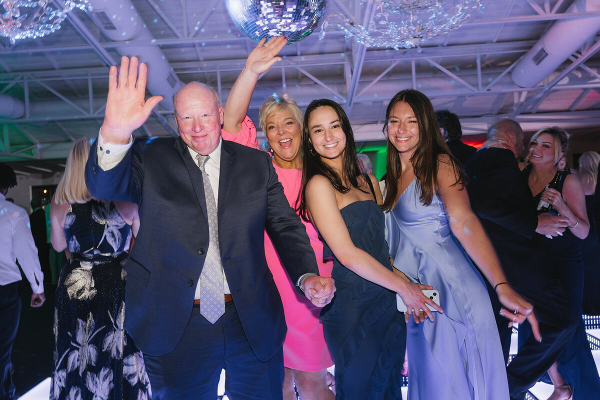 Guests dancing on dance floor at wedding reception at El Chorro