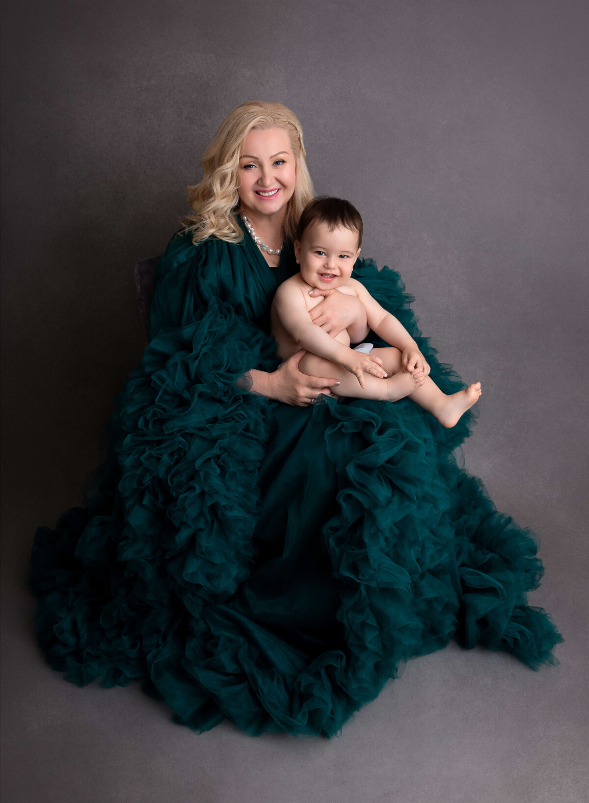 Mom holding her baby boy during baby photography session in NYC 
