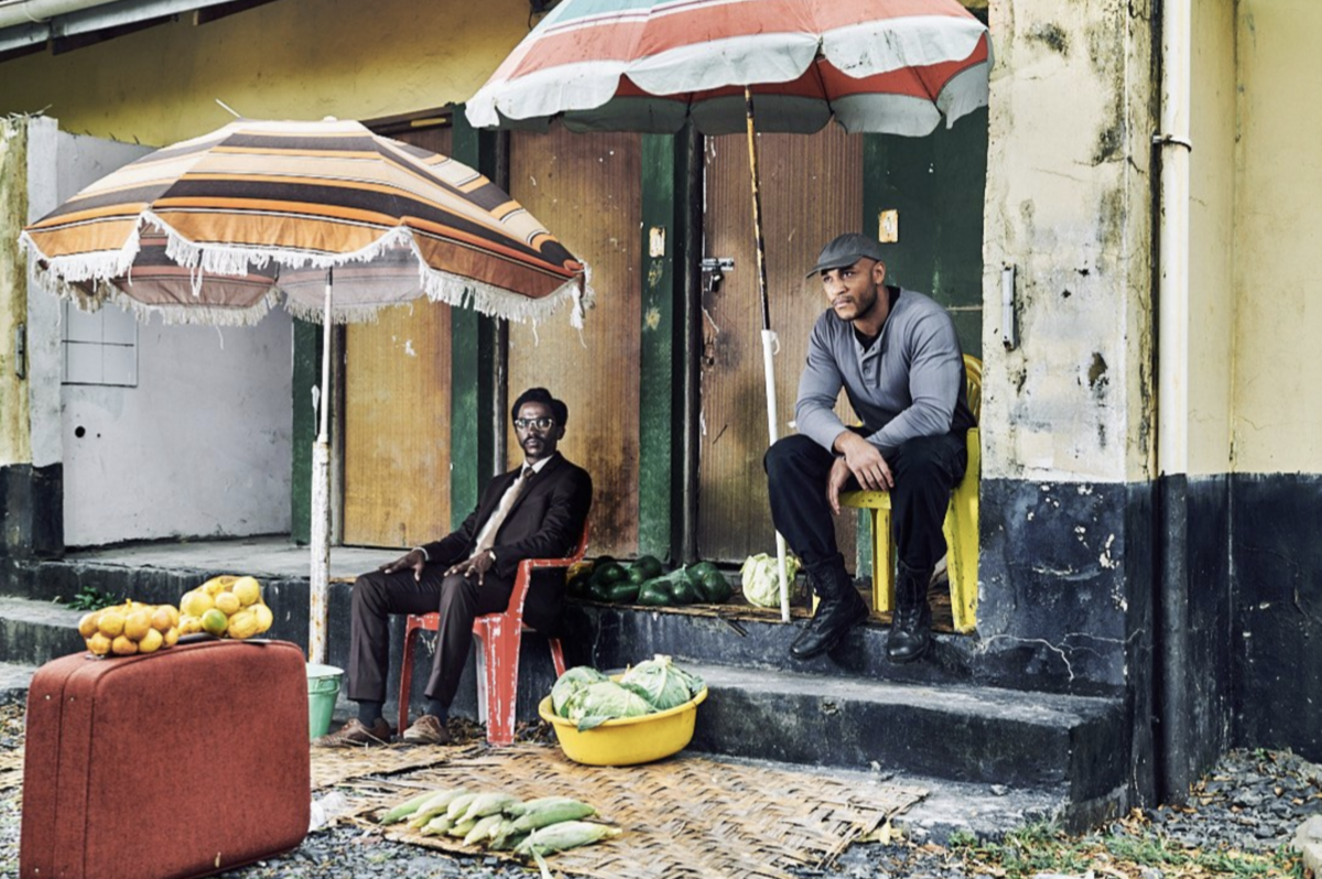 A subject surrounded by darkness and soft light suggesting inner turmoil.