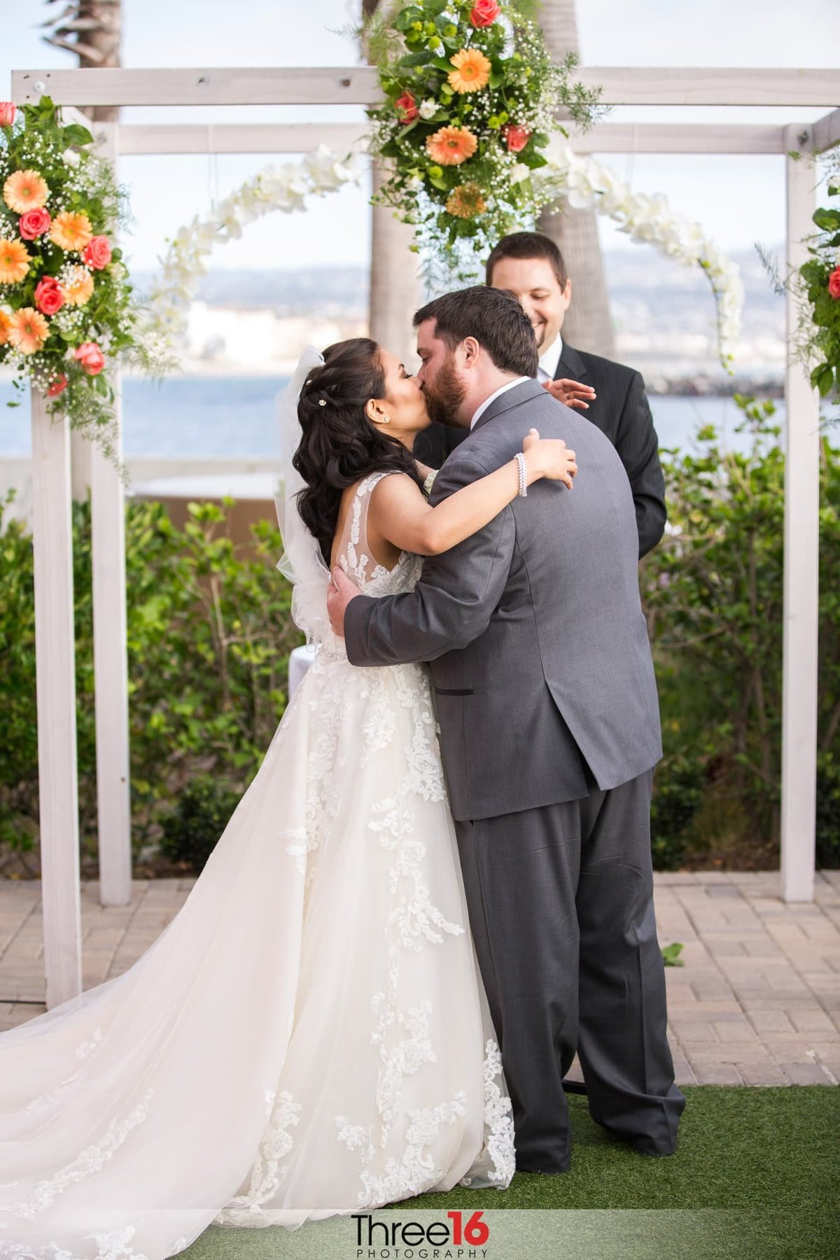 Bride and Groom share their first kiss at the altar