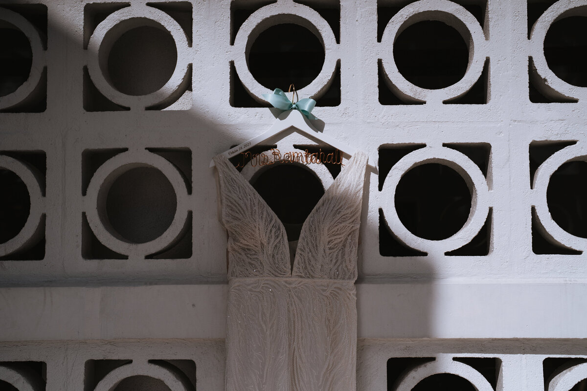 bride dress hanger on vintage wall