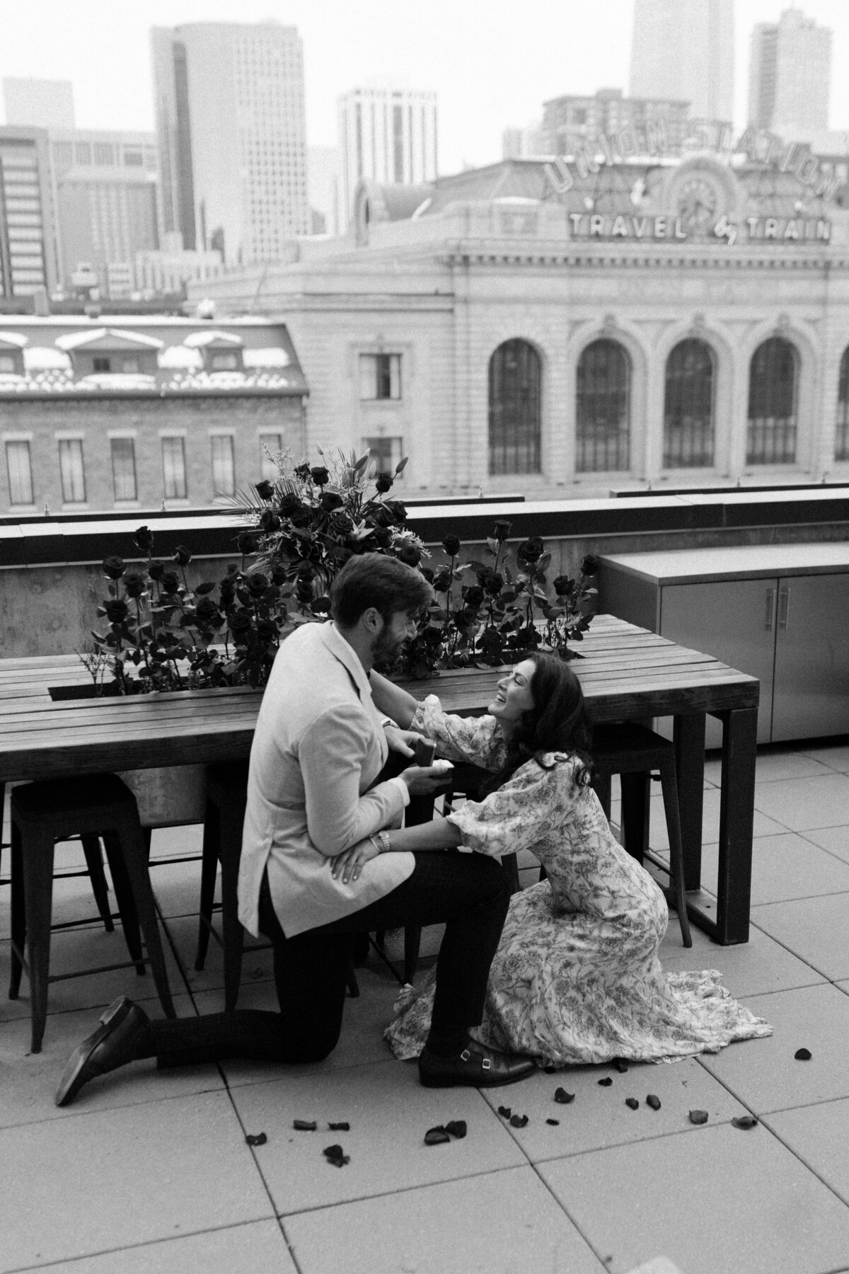 Romantic rooftop proposal overlooking Union Station in Downtown St. Paul, photographed by Emmie Verdell Photo. 