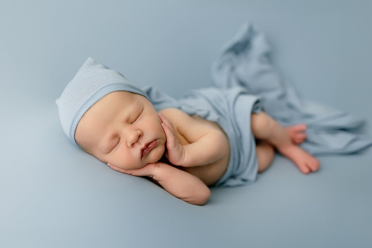 Baby boy in blue posed newborn Harrisonburg 