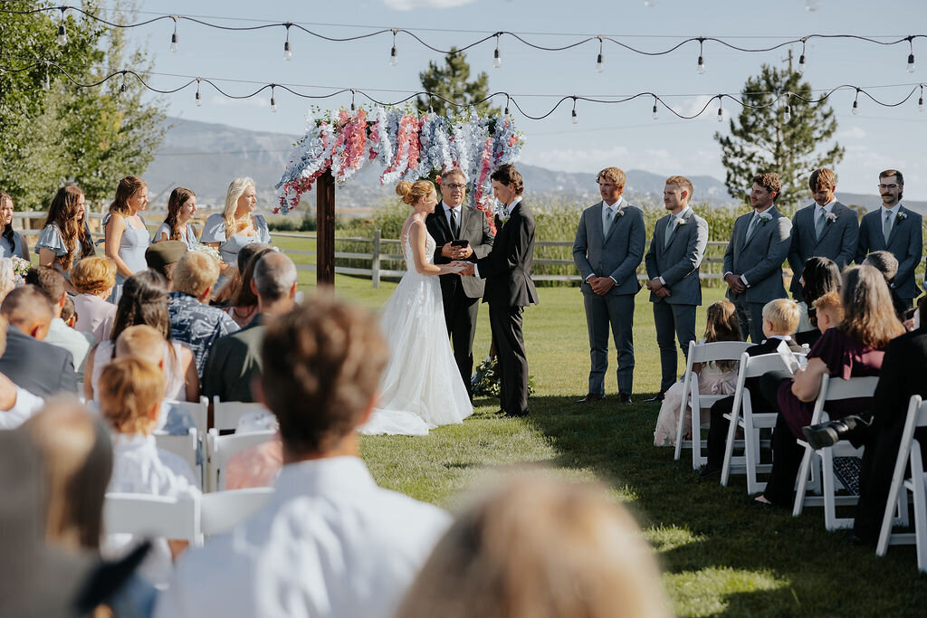 Outdoor ceremony under market lights and bunting