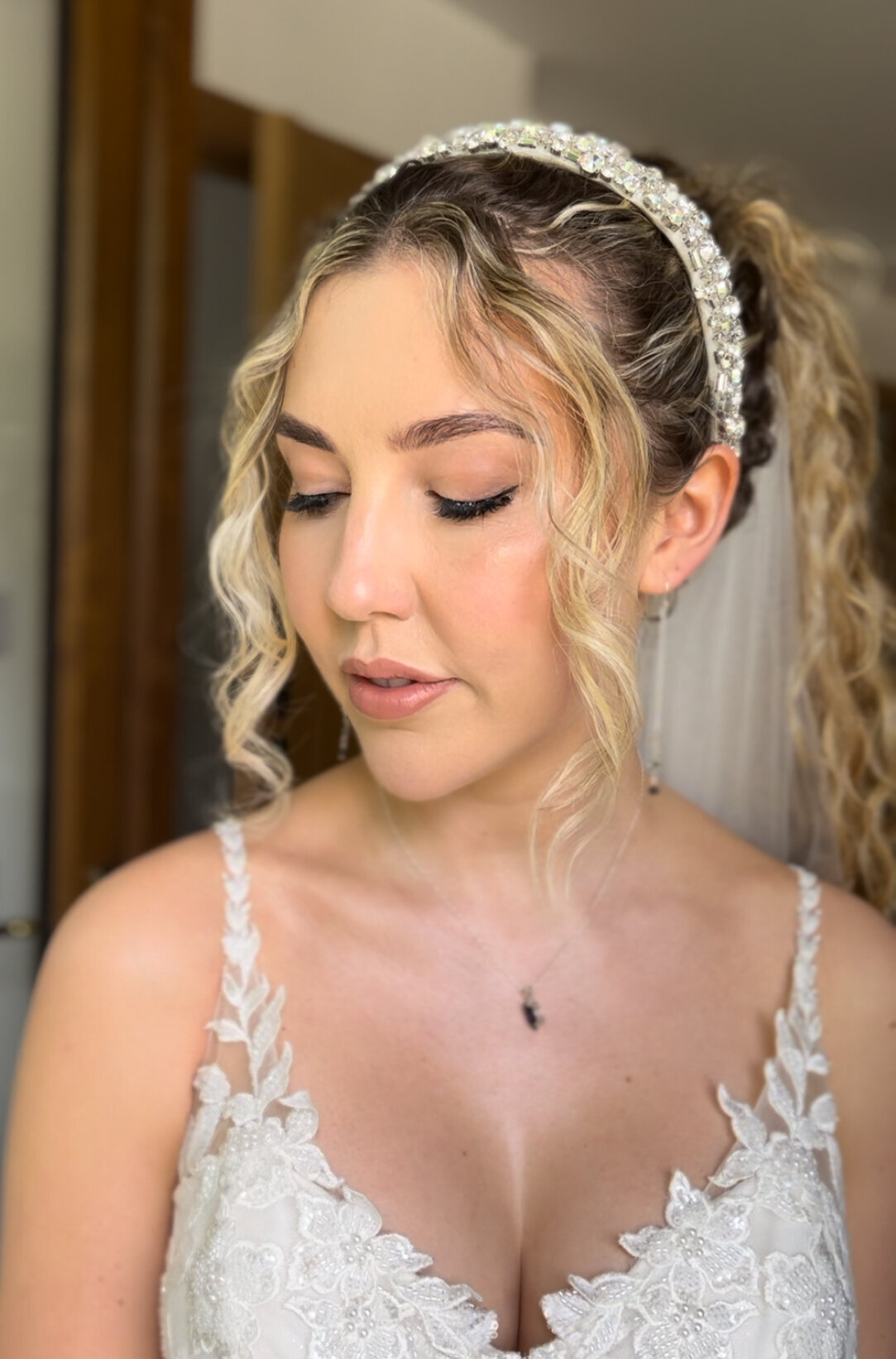 Bride hair and makeup wearing wedding dress