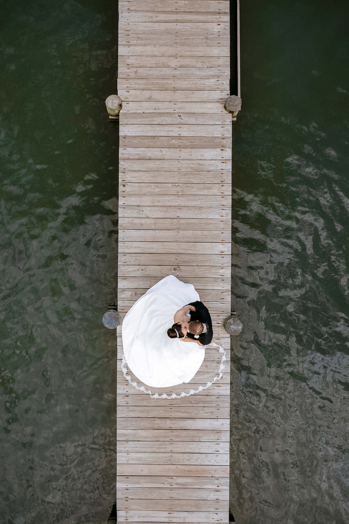 aerial-portrait-bride-groom-dock