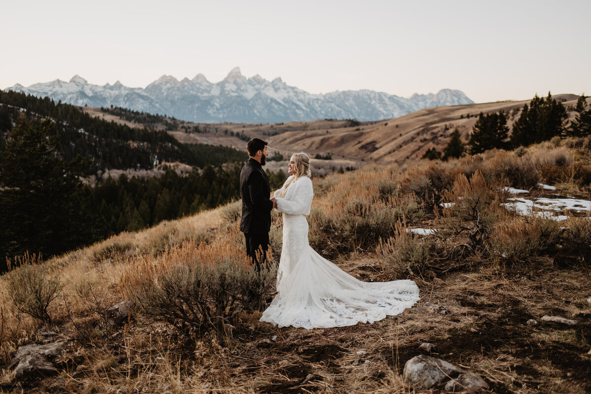 Jackson Hole Photographers capture bride and groom holding hands