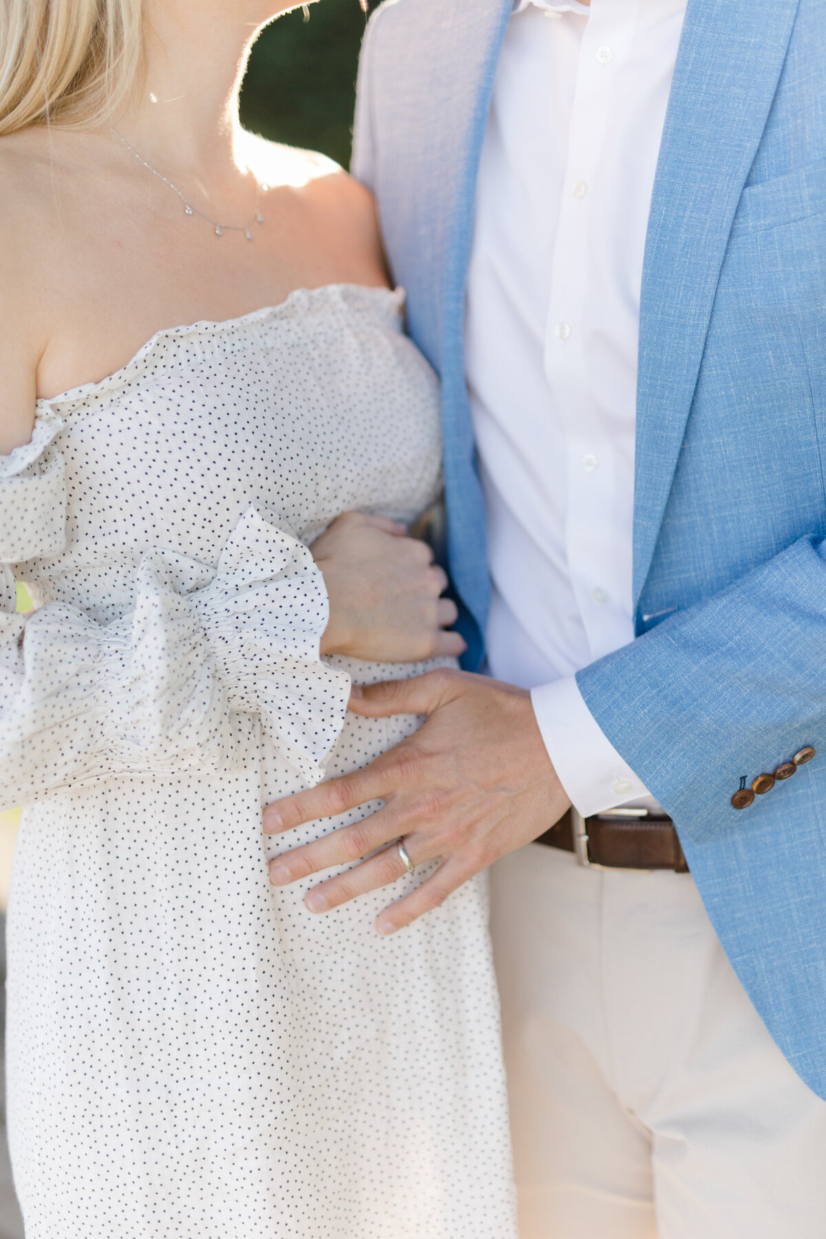 Closeup of hands on pregnant belly by NYC maternity photographer