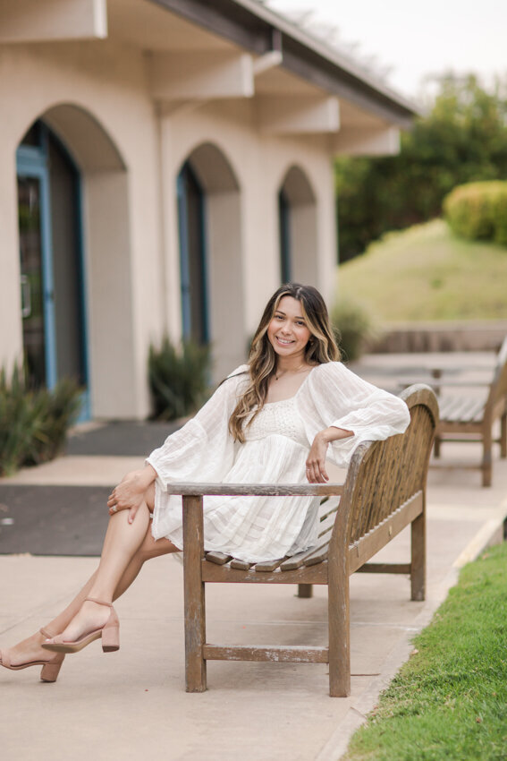 Point Loma Nazarene senior sitting on bench