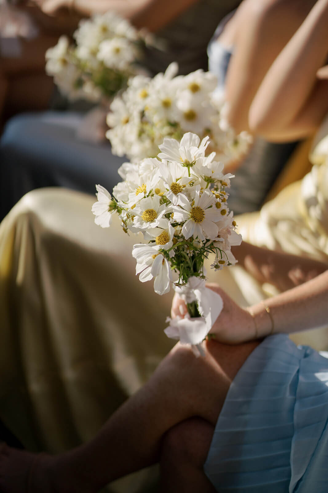 A close up image of a simply elegant bridesmaids bouquet consisting of seasonal Colorado flowers at the Aspen Meadows Resort outdoor wedding ceremony.