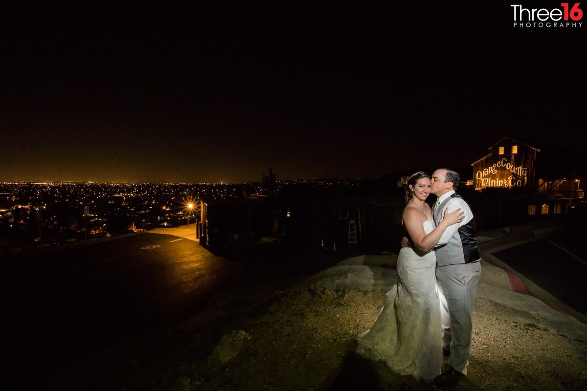 A tender moment for the Bride and Groom outside the venue at night