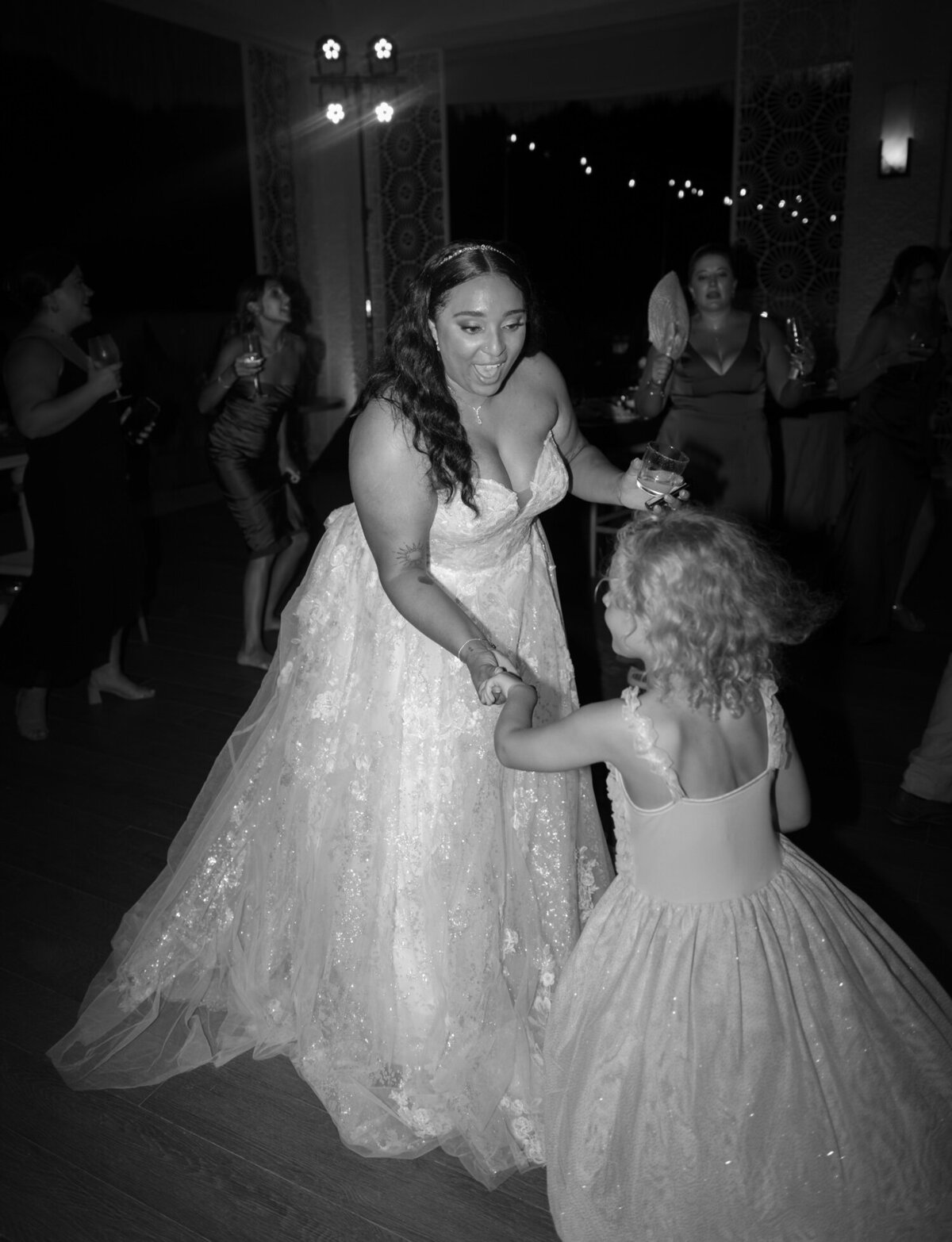 bride dances with flower girl, Mexico destination wedding in Playa del Carmen