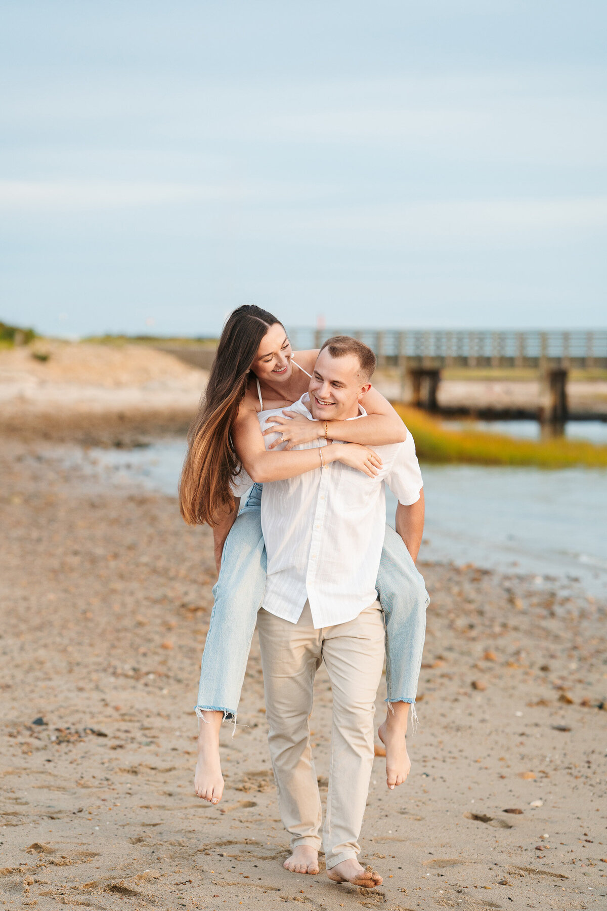 Candid ocean engagement portraits in New England with relaxed emotional storytelling