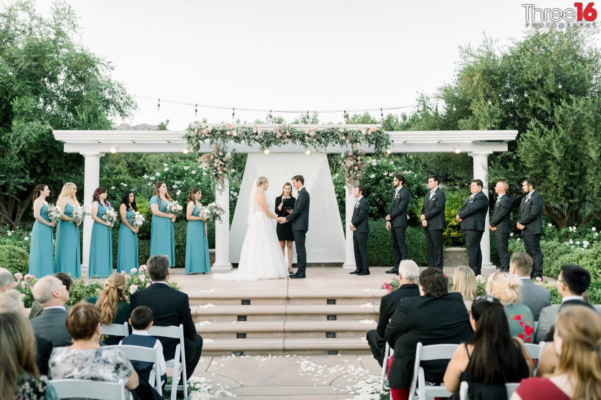 Couple taking their vows at a Bella Vista Groves wedding venue in Fillmore, CA