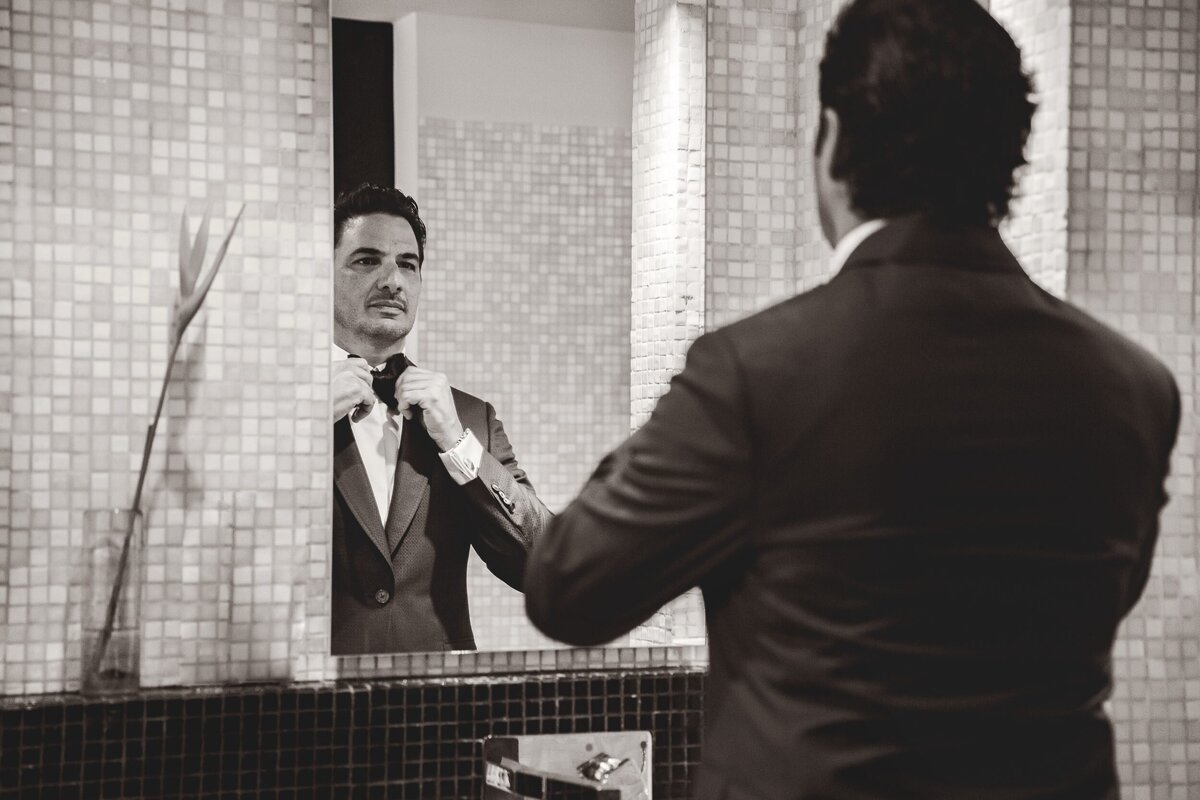 Groom getting ready before ceremony at wedding in Riviera Maya