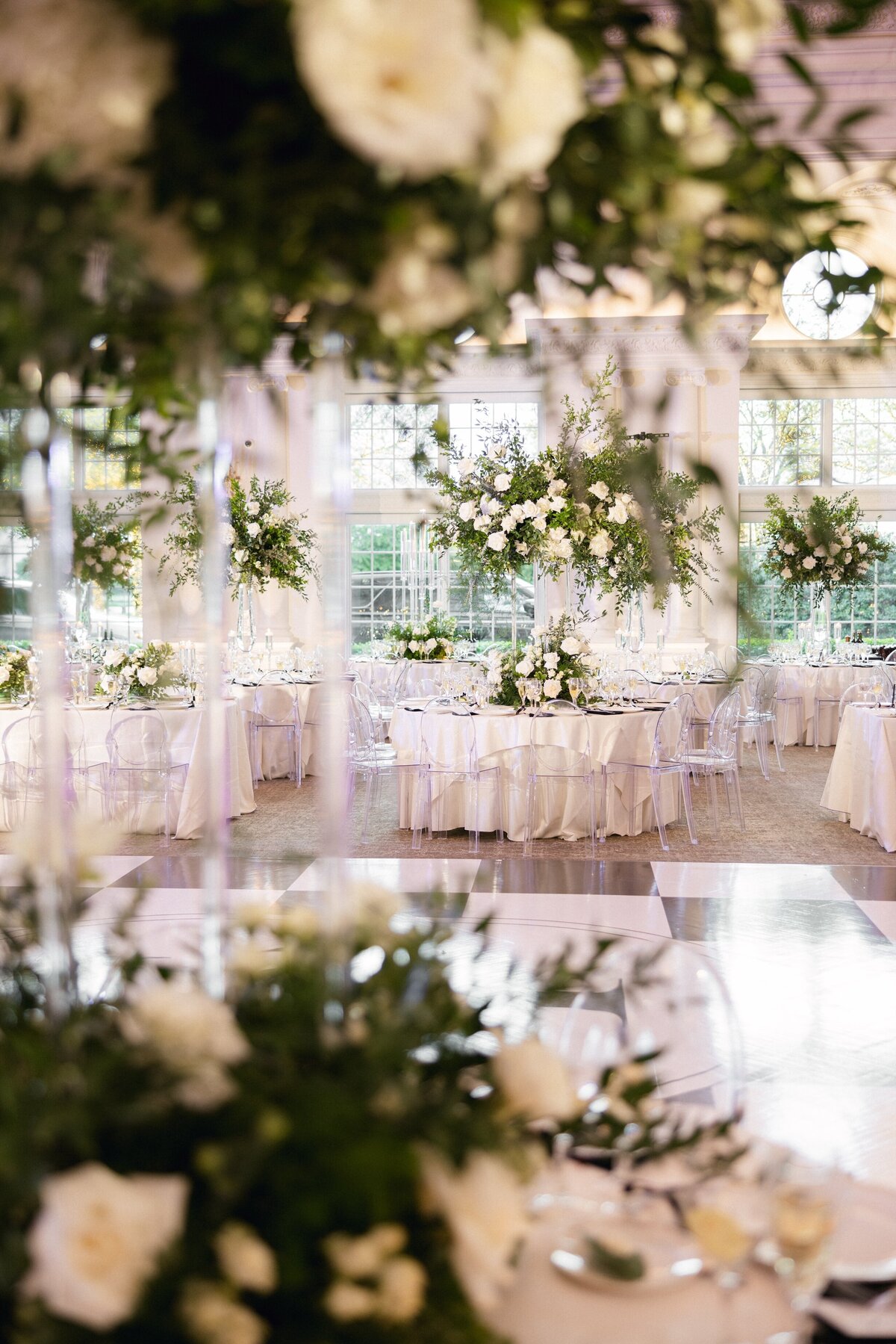 Candlelit wedding reception table with elegant florals and gold accents at Park Château in East Brunswick NJ