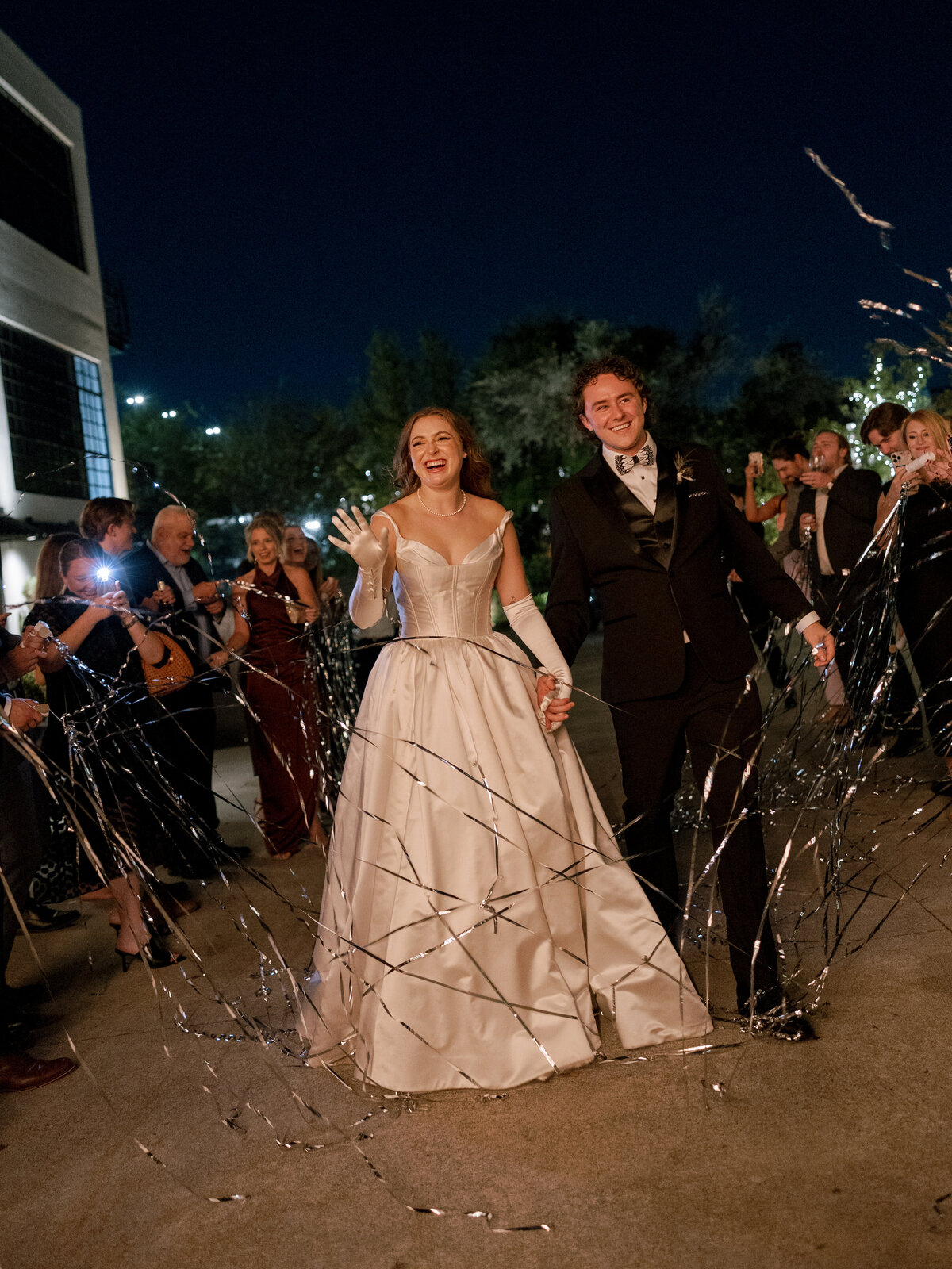 A photo of the bride and groom during the reception  at their Astorian wedding in Houston.