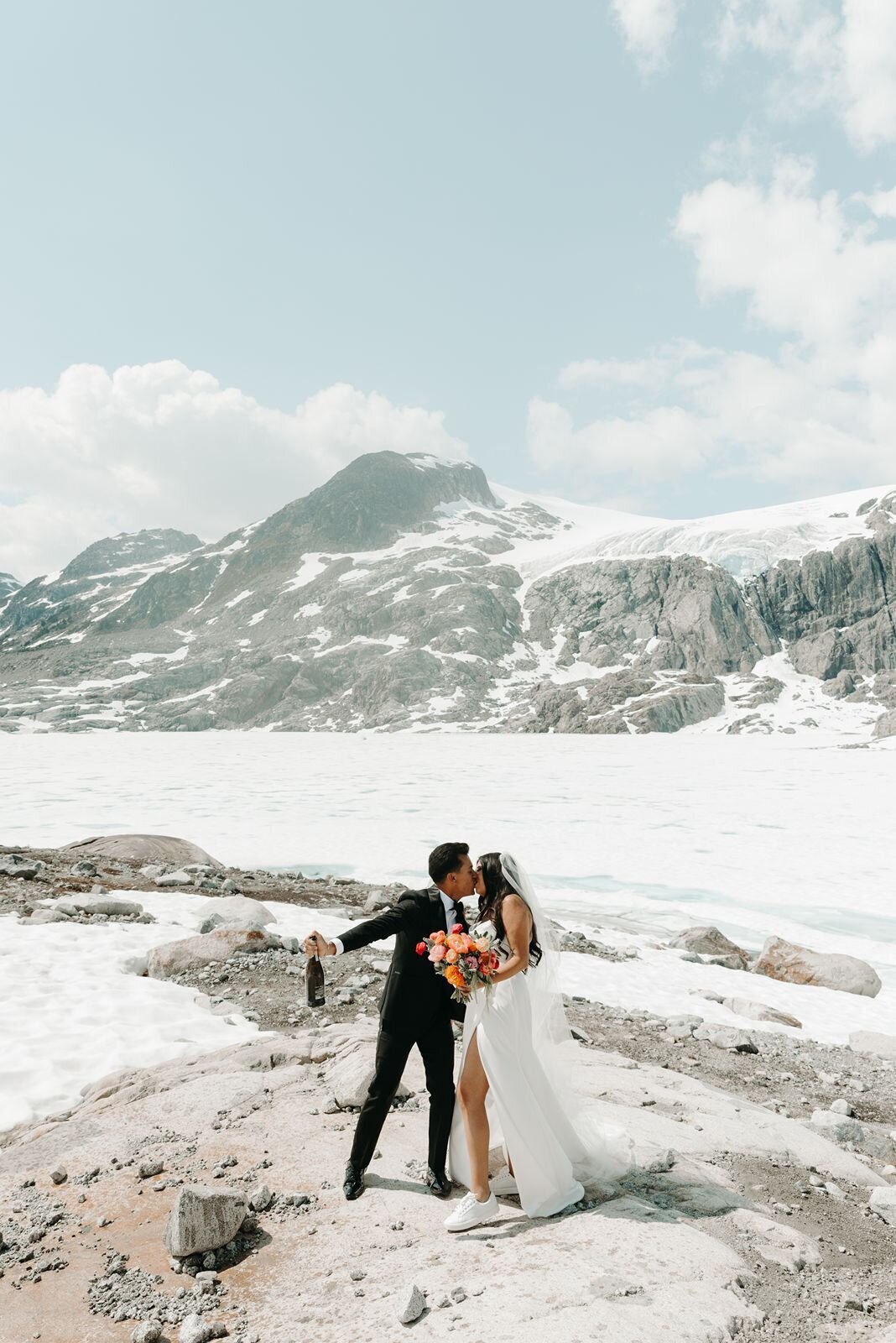 Whistler wedding couples snowtop Mountain celebrating