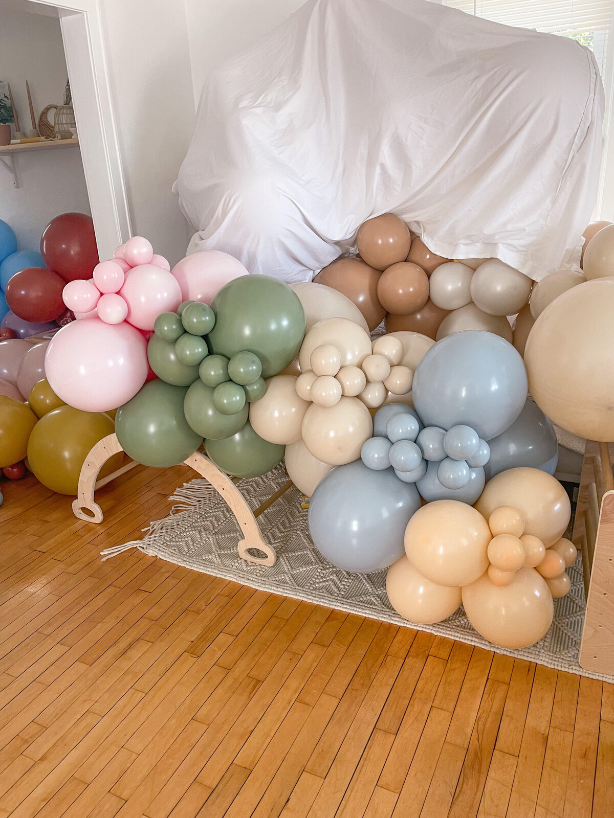 Various color and different size balloons tied together.