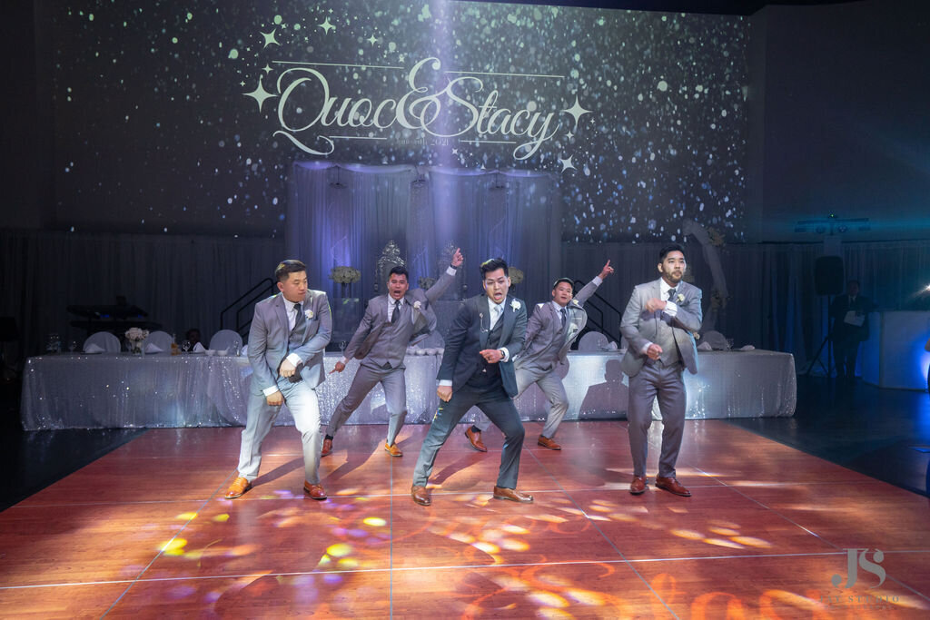 Groomsmen perform a surprise dance at the reception.