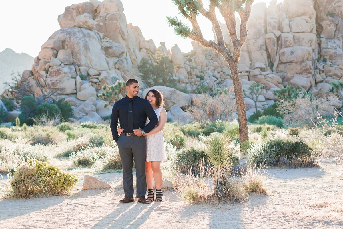 bride and groom read vows in the desert