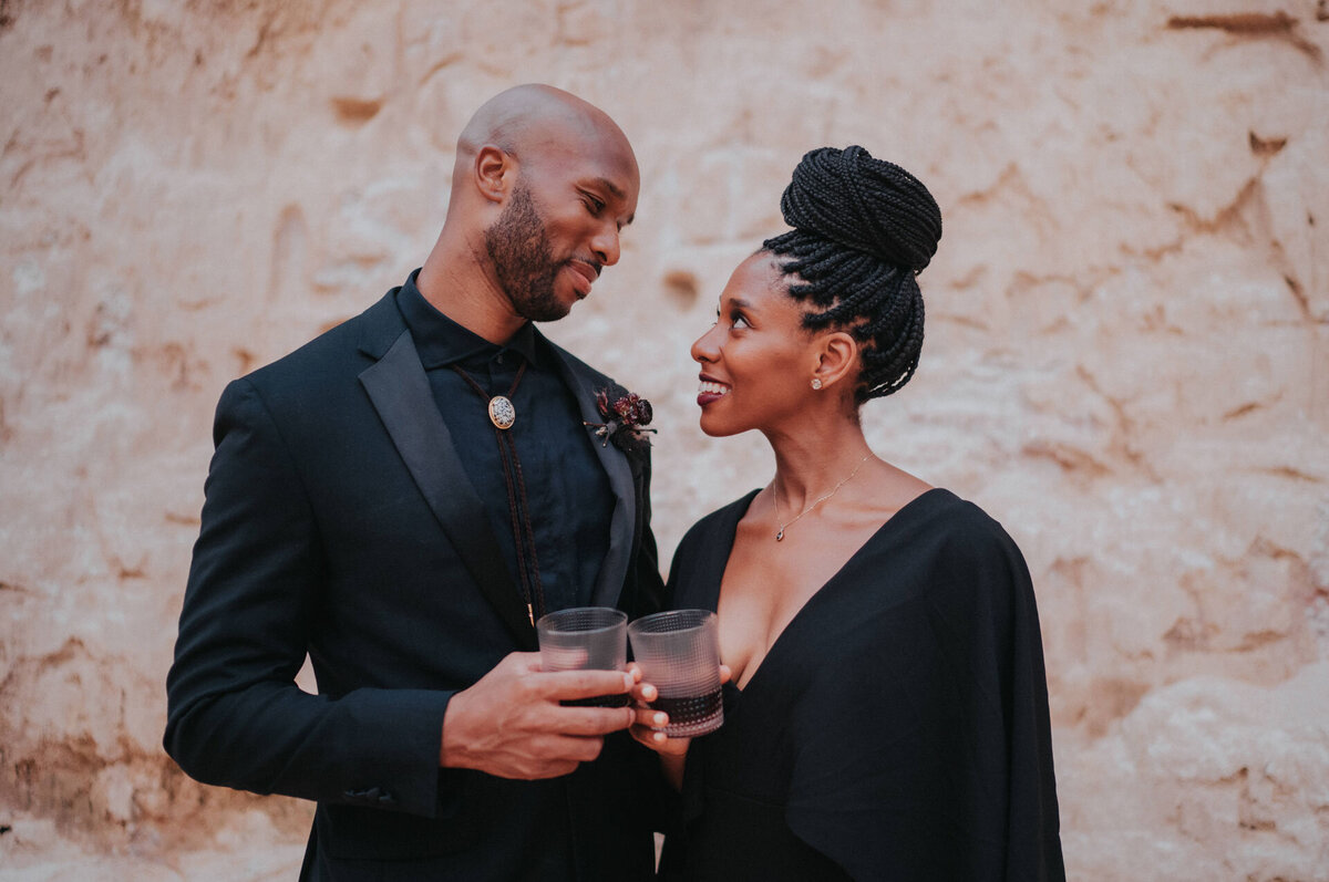 Black couple wearing black outfits