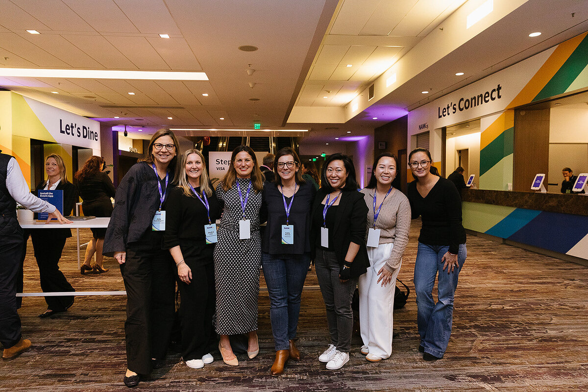 group phot of 7 women at the conference for Visa NAMK25