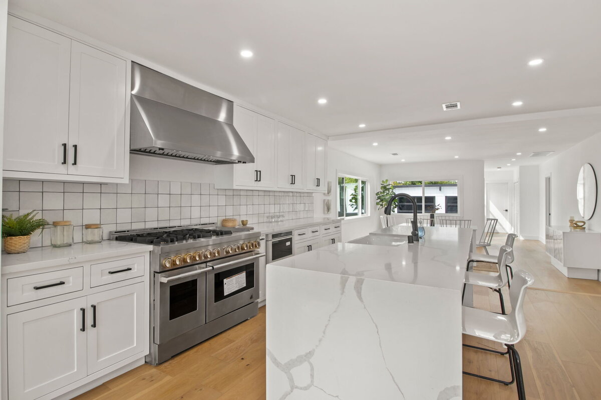 modern-black-kitchen-with-waterfall-island-open-concept