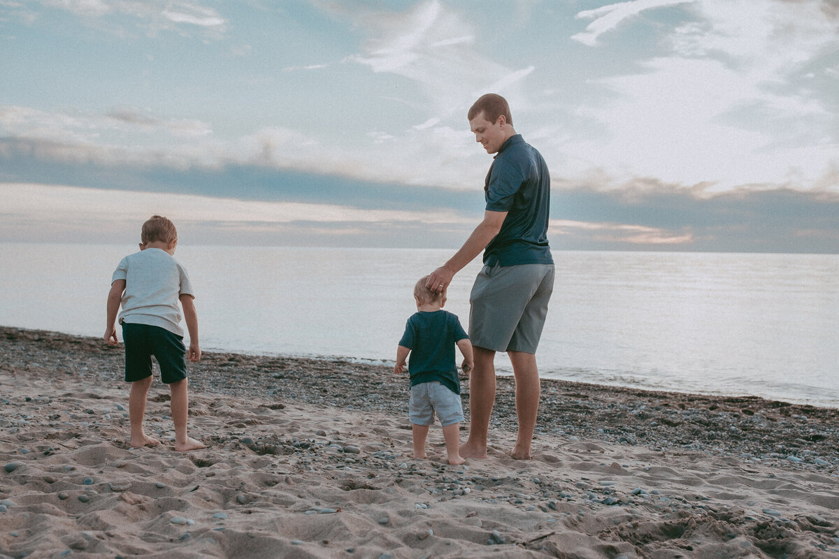 dad and sons on beach in ohio