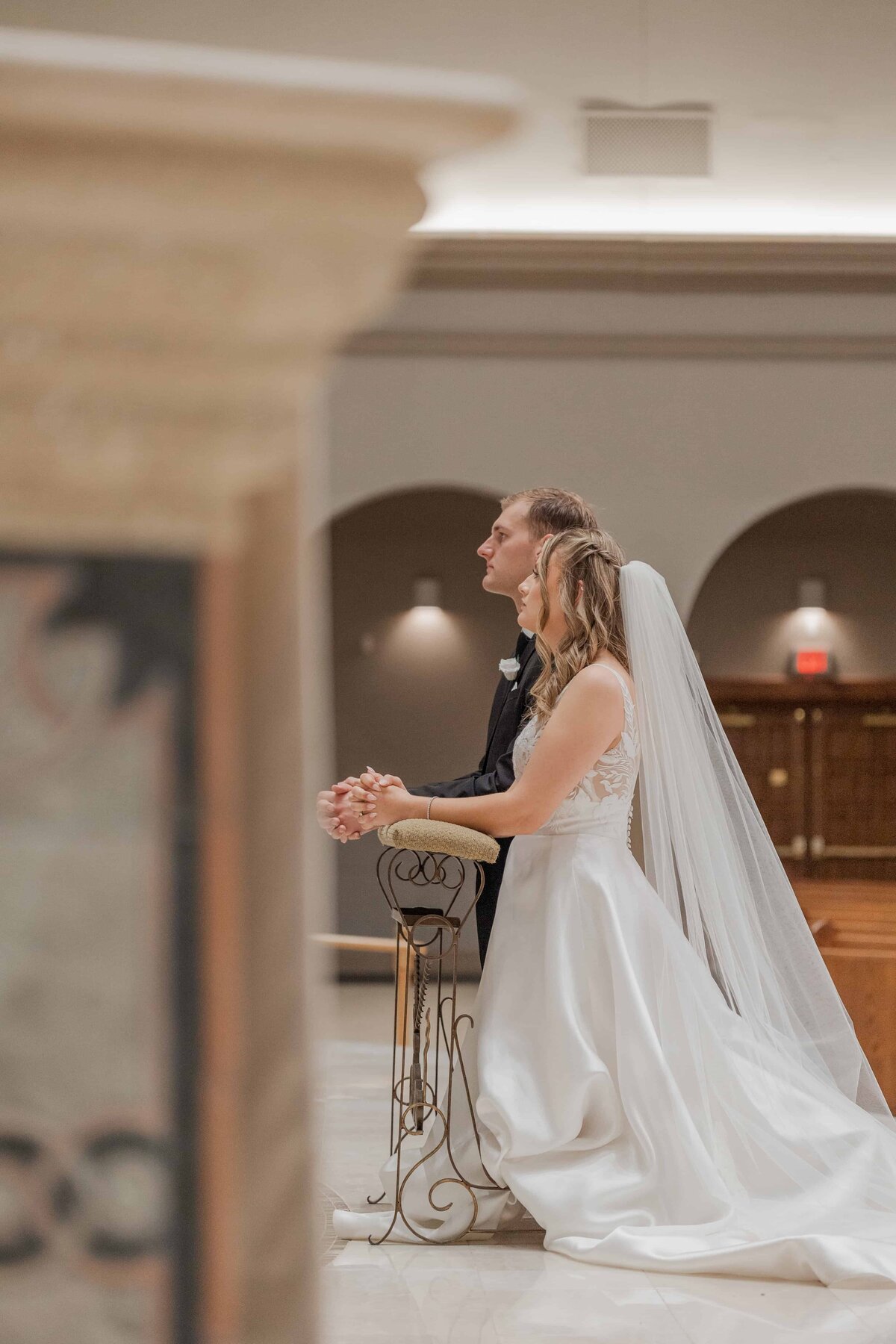 Bride and groom during Catholic Wedding Mass, St Joseph’s Catholic Church, Jacksonville FL