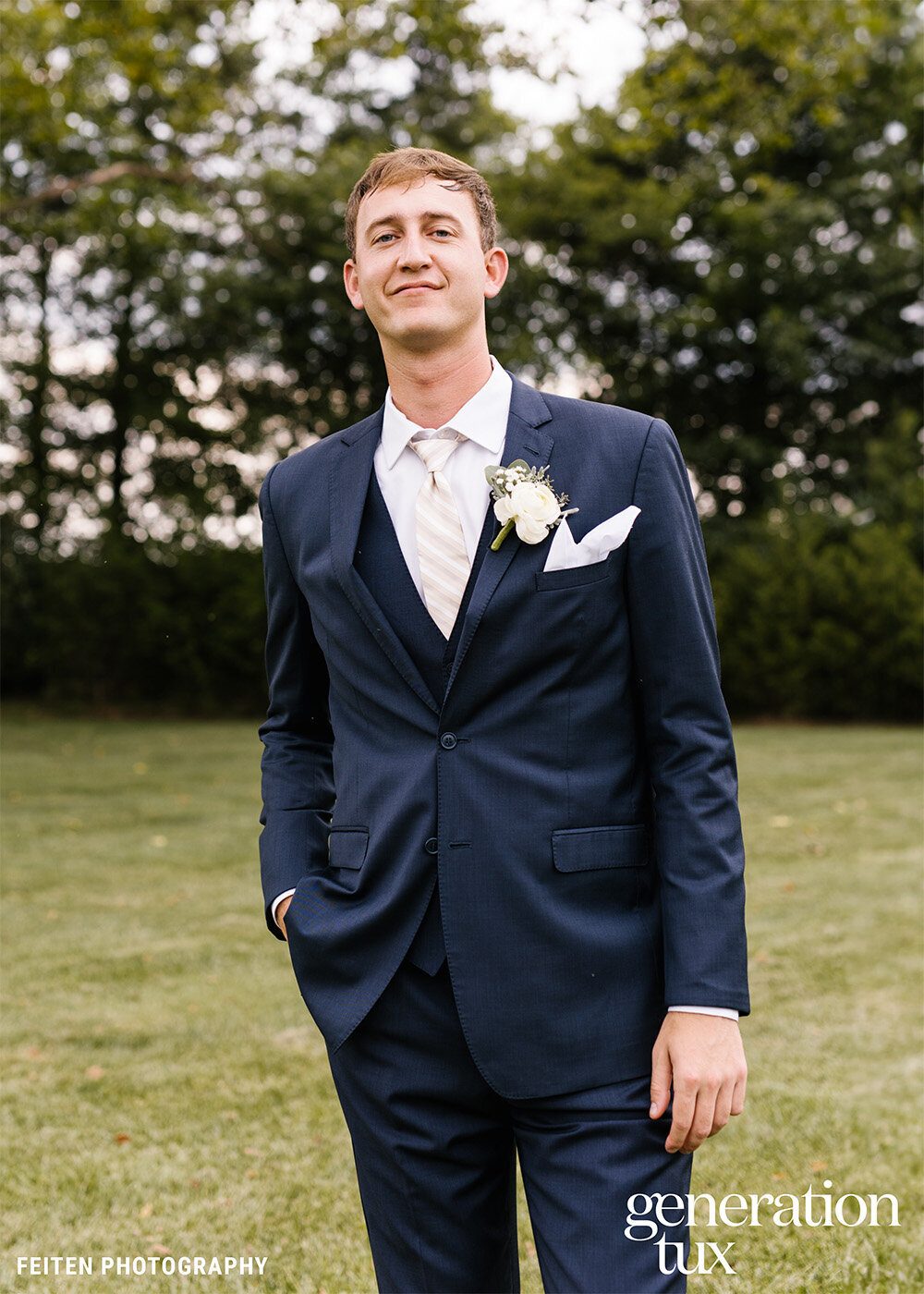 Navy Blue Notch Lapel Suit Champagne Stripe Tie White Pocket Square_Credit + Logo