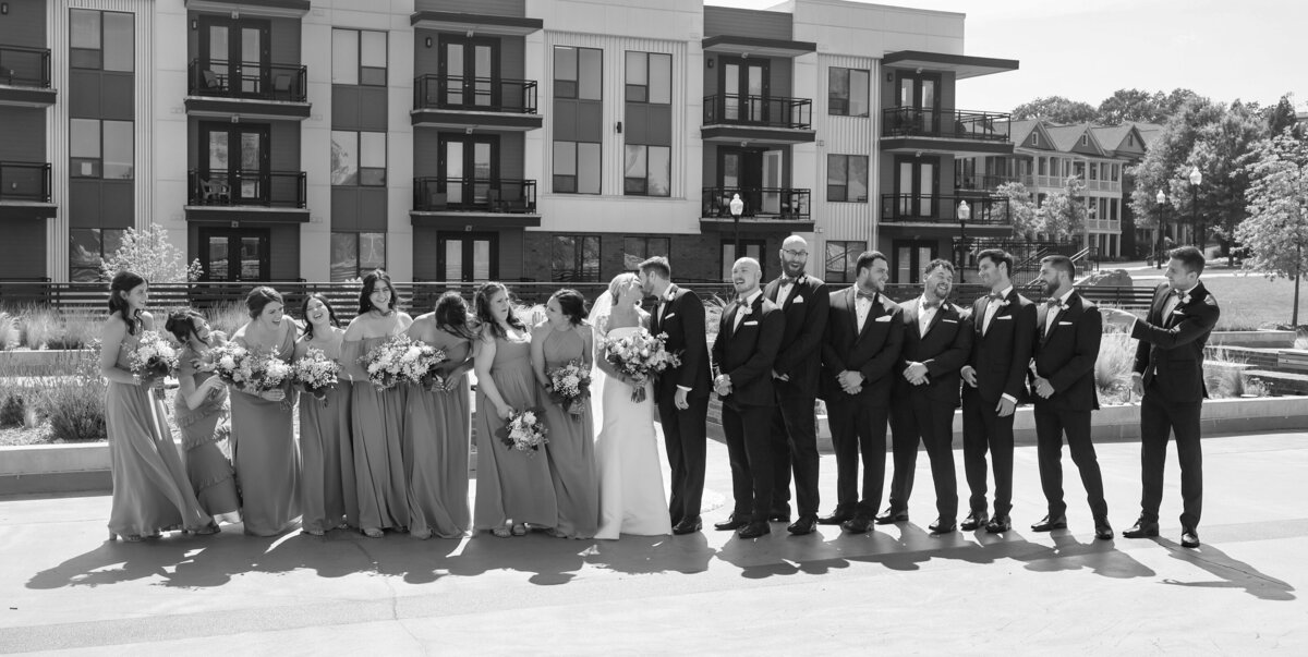 wedding couple walking with bridal party