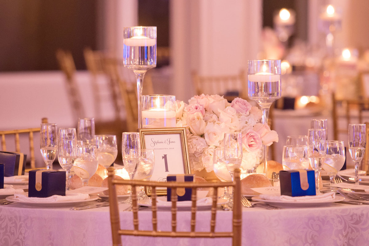 Table setting with blue box wedding favors Soundview Caterers