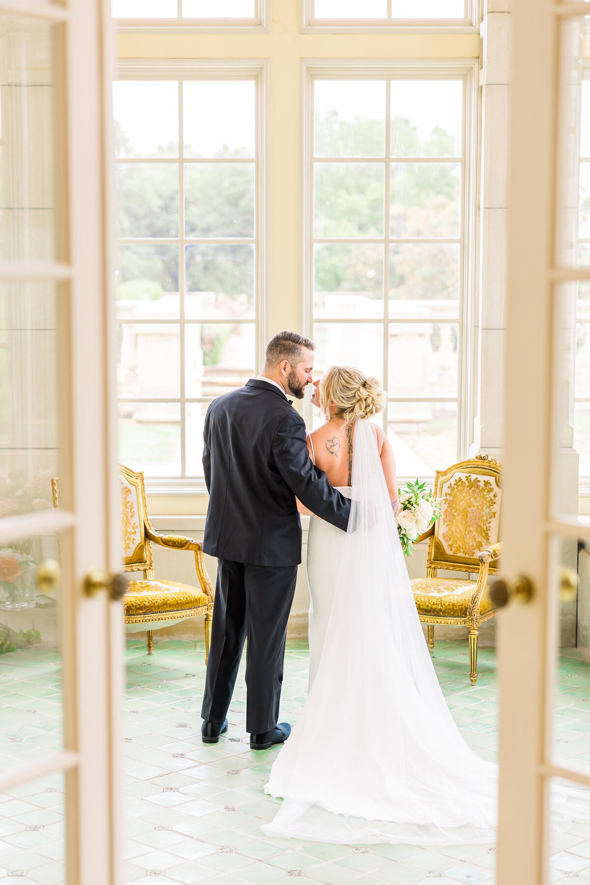 bride-and-groom-share-an-intimate-moment-in-tea-room