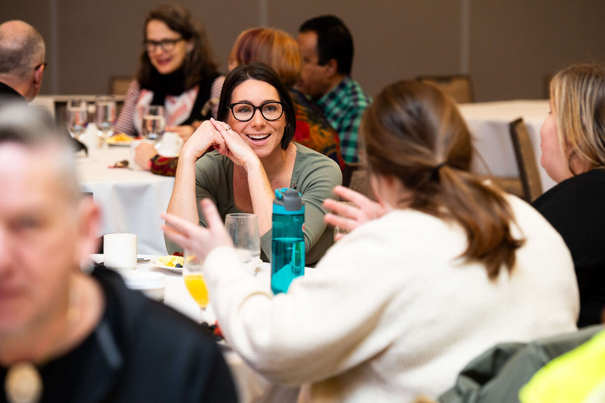 Ottawa event photography showing attendees interacting in a round-table discussion during a 2-day corporate conference.  Captured by JEMMAN Photography COMMERCIAL