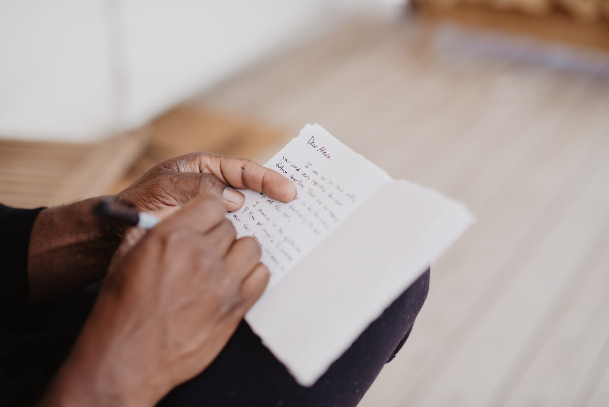 Utah Elopement Photographer captures man holding vow book