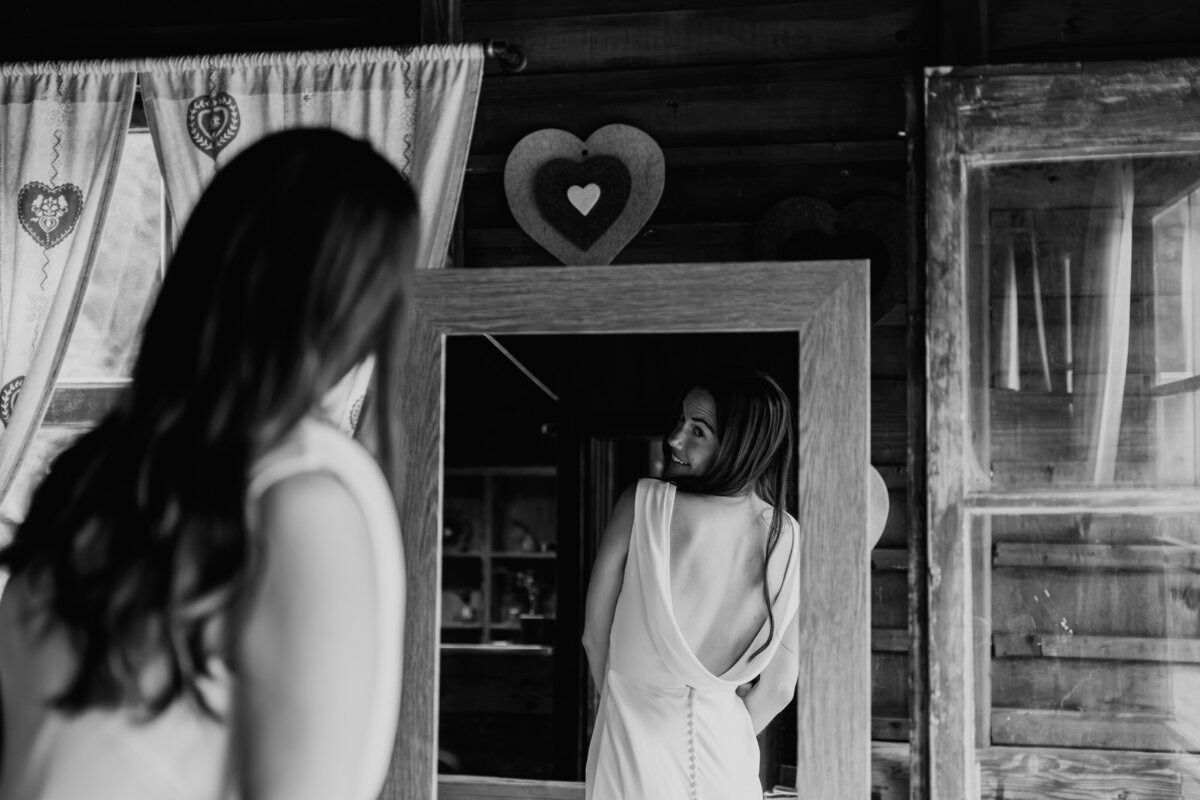 bride in dolomites lake Braies elopement