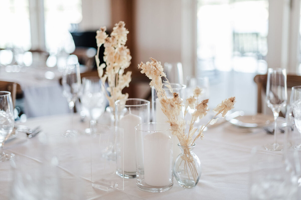 dried botanicals with pillar candles