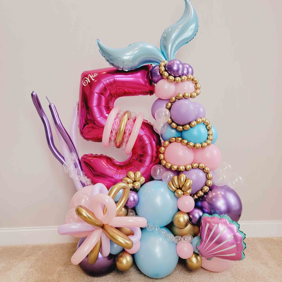 Girls' celebrations premium balloon bouquet featuring a whimsical Pink and Blue Little Mermaid theme. The event in the magic of our expertly crafted balloon artistry