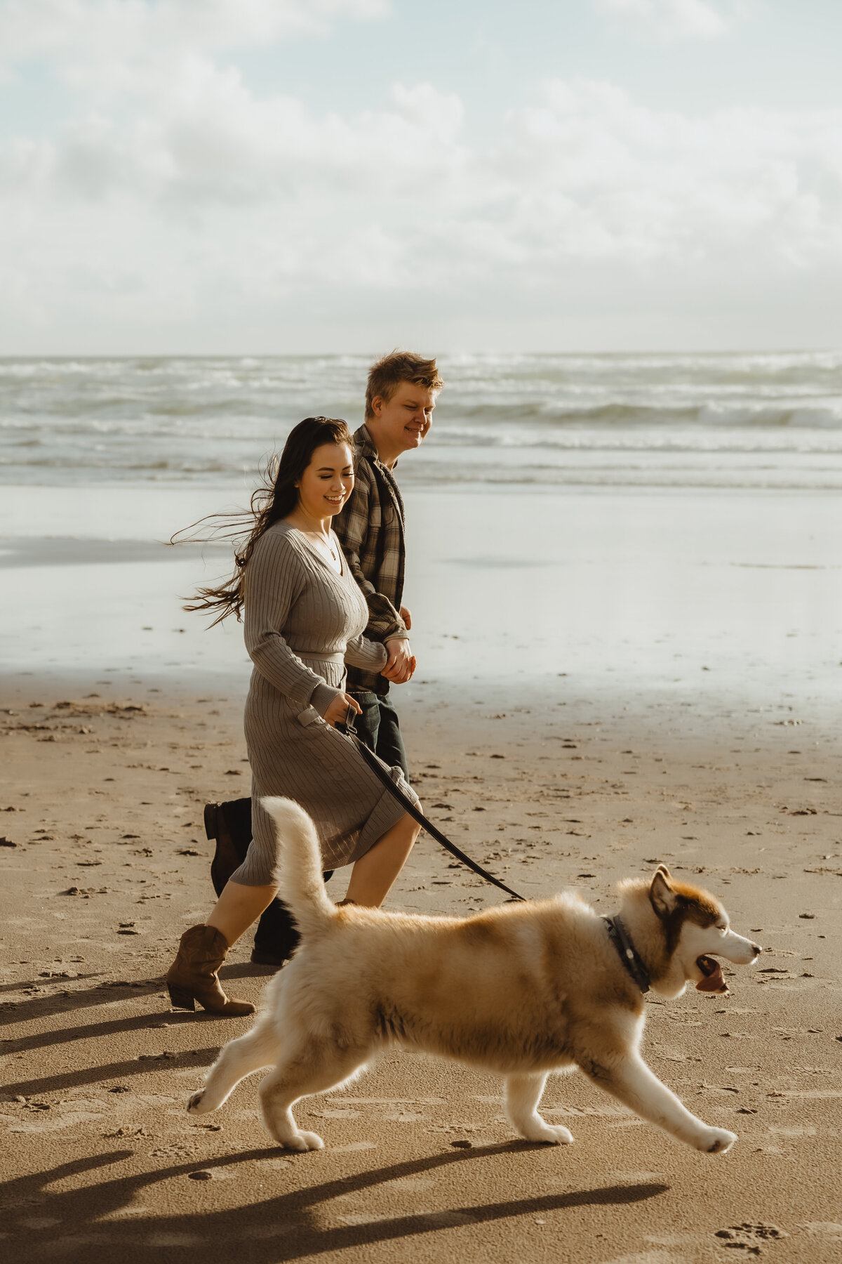 COASTAL COUPLE WITH HUSKY