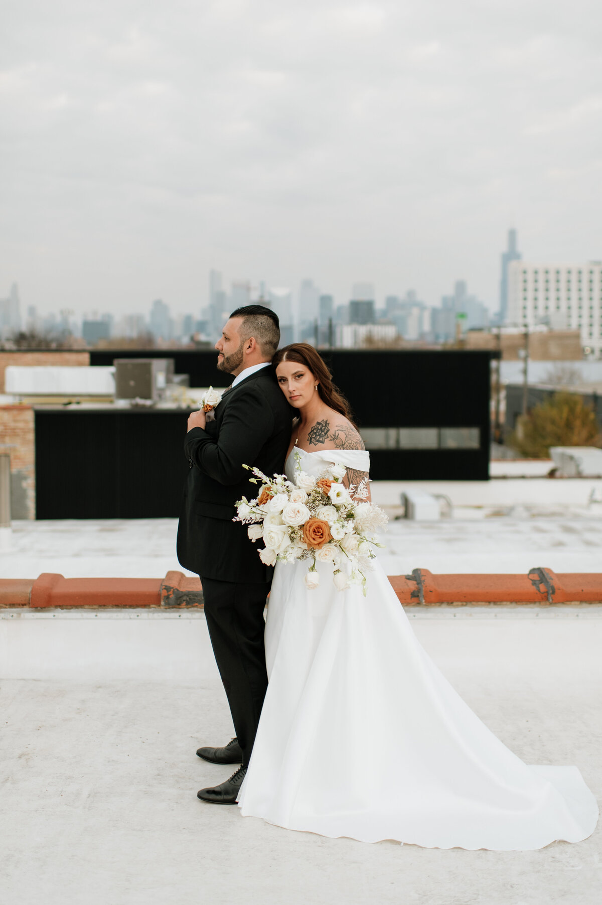 Bride and groom rooftop wedding portrait