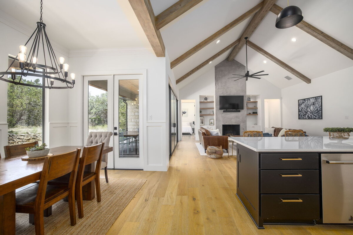 modern design dining room next to open kitchen and living area
