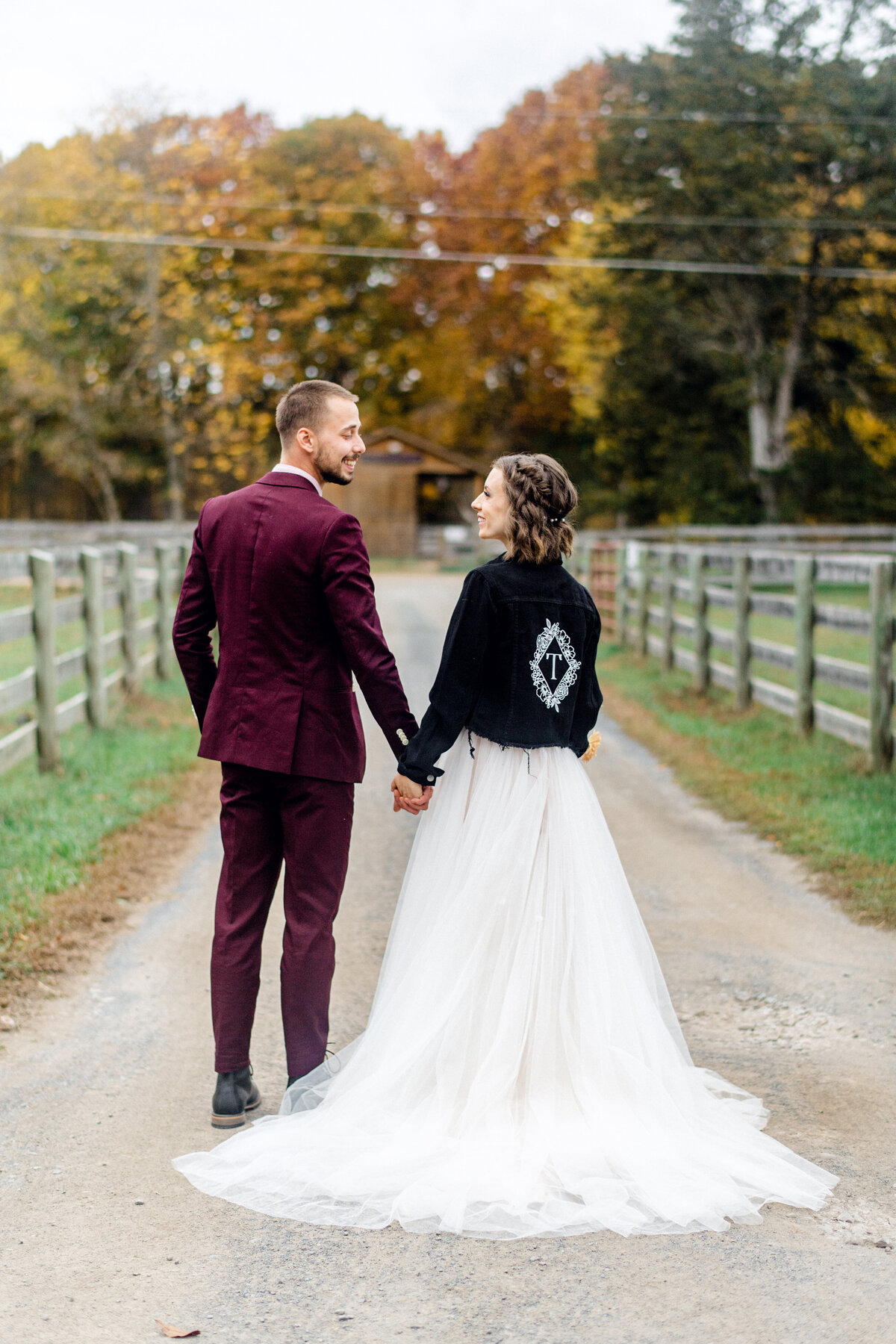 Vegan short haired bride holding grooms hand at animal sanctuary