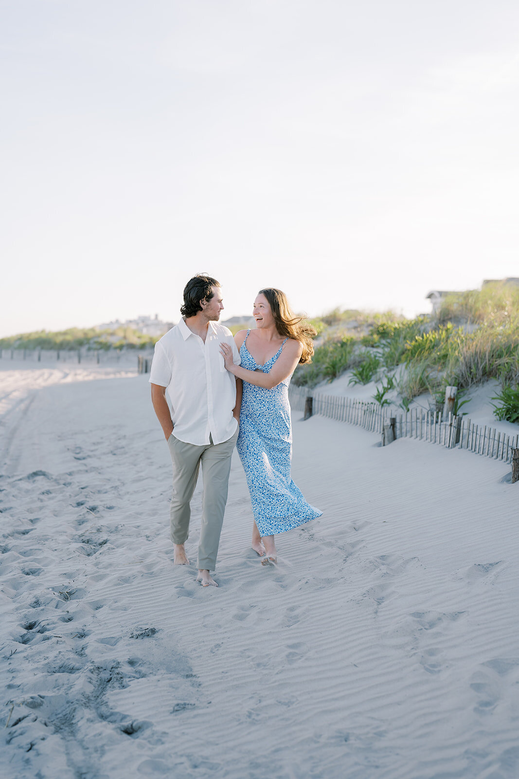 Couple walking on the beach in Longport, NJ