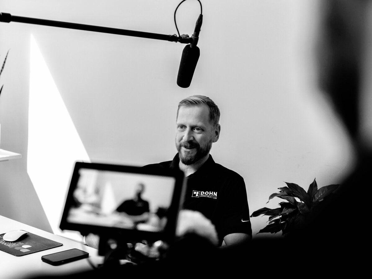 A close-up image of a videographer behind the camera, focused on capturing an authentic moment. This photo highlights the expertise and passion behind video content creation at Future Fox Media in Denver, Colorado.
