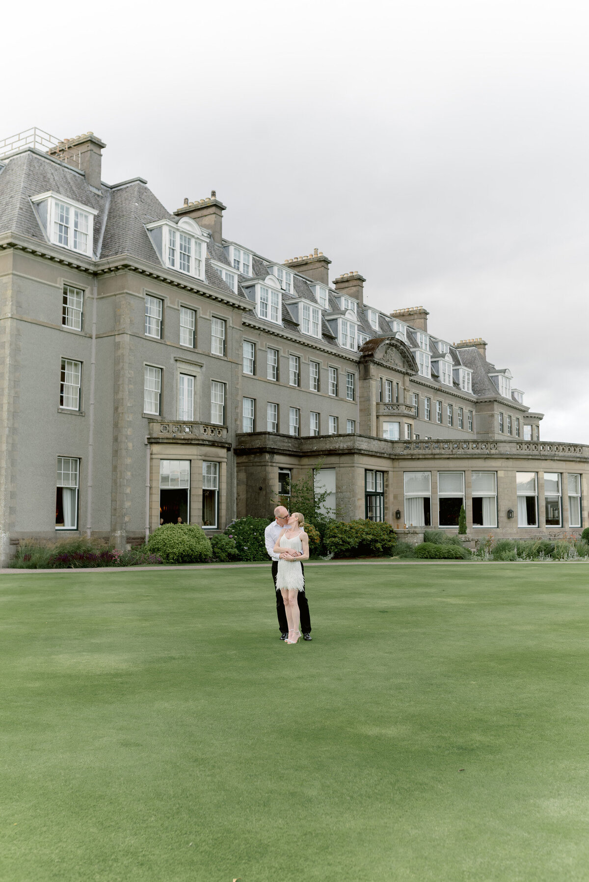 Bride and Groom in the grounds of Gleneagles on their wedding day. Image by luxury wedding photographer, Jill Cherry Porter.