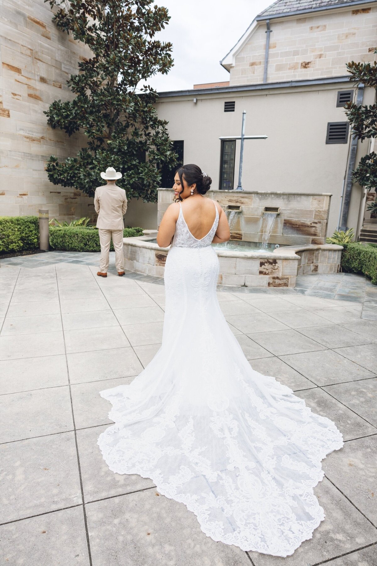 Bride walking toward groom for first look moment