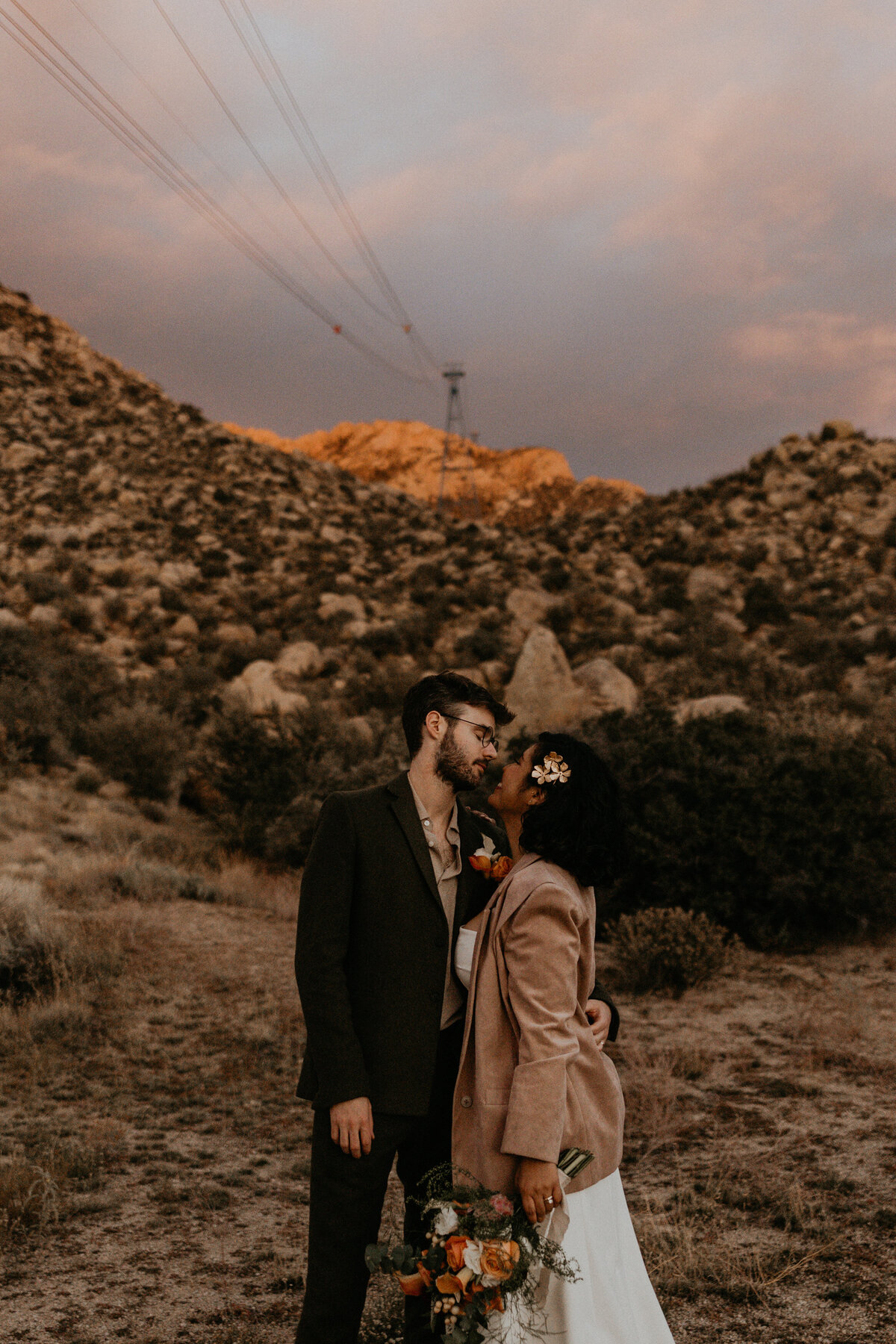 newlyweds kissing on the Sandia foothills in Albuquerque