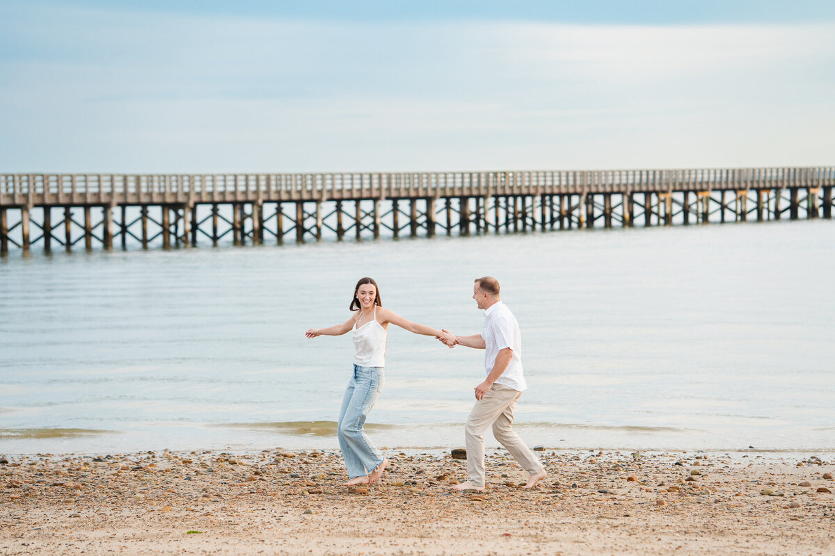 Candid ocean engagement portraits in New England with relaxed emotional storytelling