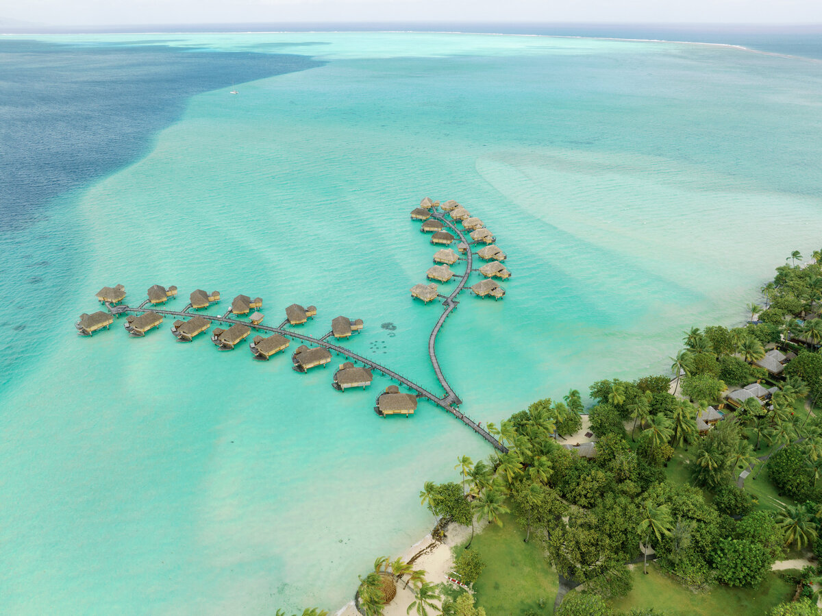 Aerial Drone View with the bride and groom in the heart at Le tahaa island resort